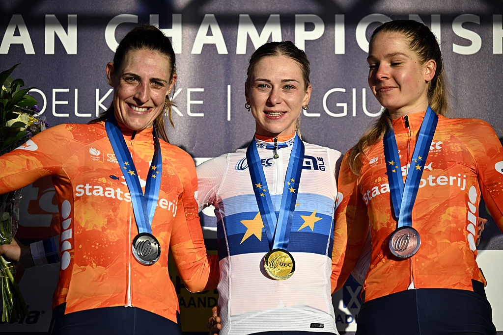 Second placed Dutch rider Lucinda Brand, first placed Dutch rider Inge van der Heijden and third placed Dutch rider Aniek Van Alphen celebrate on the podium after the elite women race at the UEC Cyclocross European Championships in Middelkerke on November 8, 2025. (Photo by JASPER JACOBS / Belga / AFP) / Belgium OUT