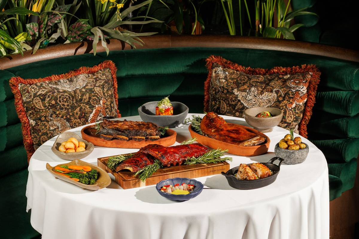 a feast of meat dishes arranged on a table at amazonico as part of their festive menus offering