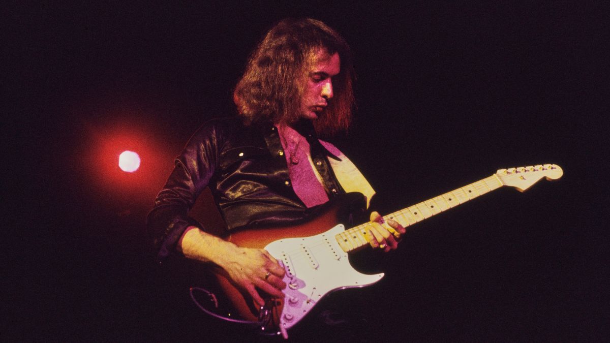 British guitarist and songwriter Ritchie Blackmore, wearing a black shirt, playing a Fender Stratocaster in sunburst, as his band, British rock band Deep Purple, performs live, 1972