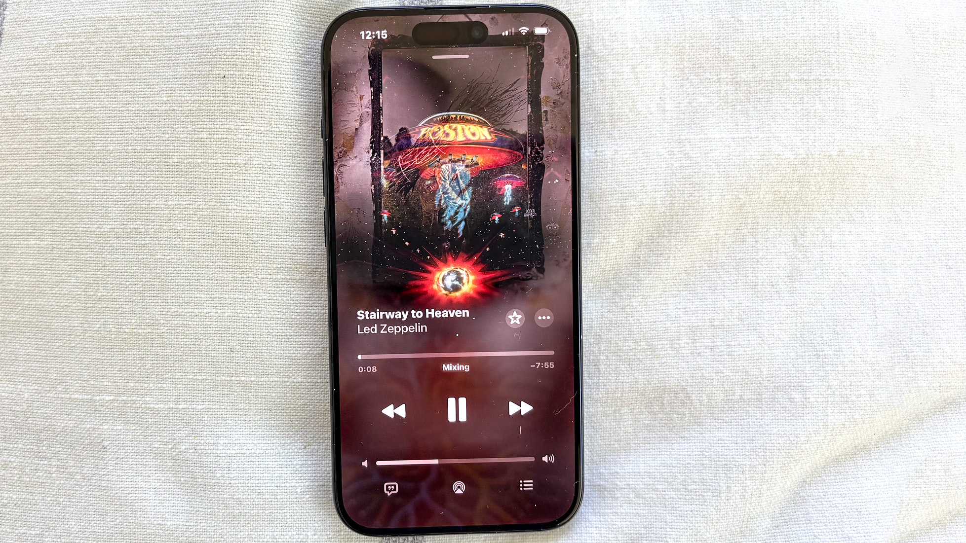 AutoMix transitions between album art in Apple Music on an iPhone running iOS 26