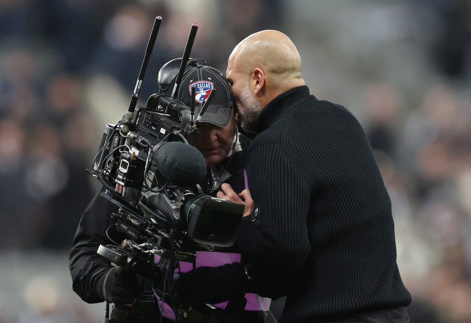 Manchester City boss Pep Guardiola clashes with a camera operator