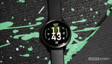 A Garmin Venu 4 displays a watch face.