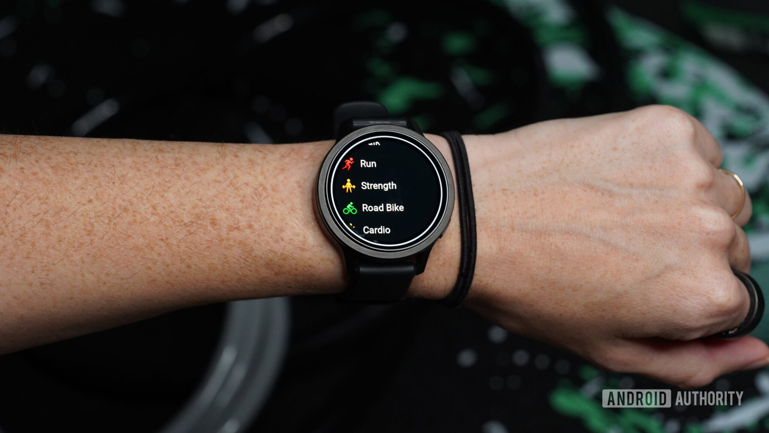 A Garmin Venu 4 displays a user's activity list.