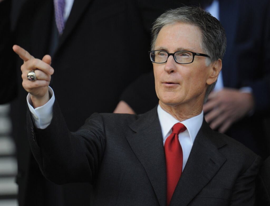 Liverpool and FSG co-owner John Henry points at something out-of-frame
