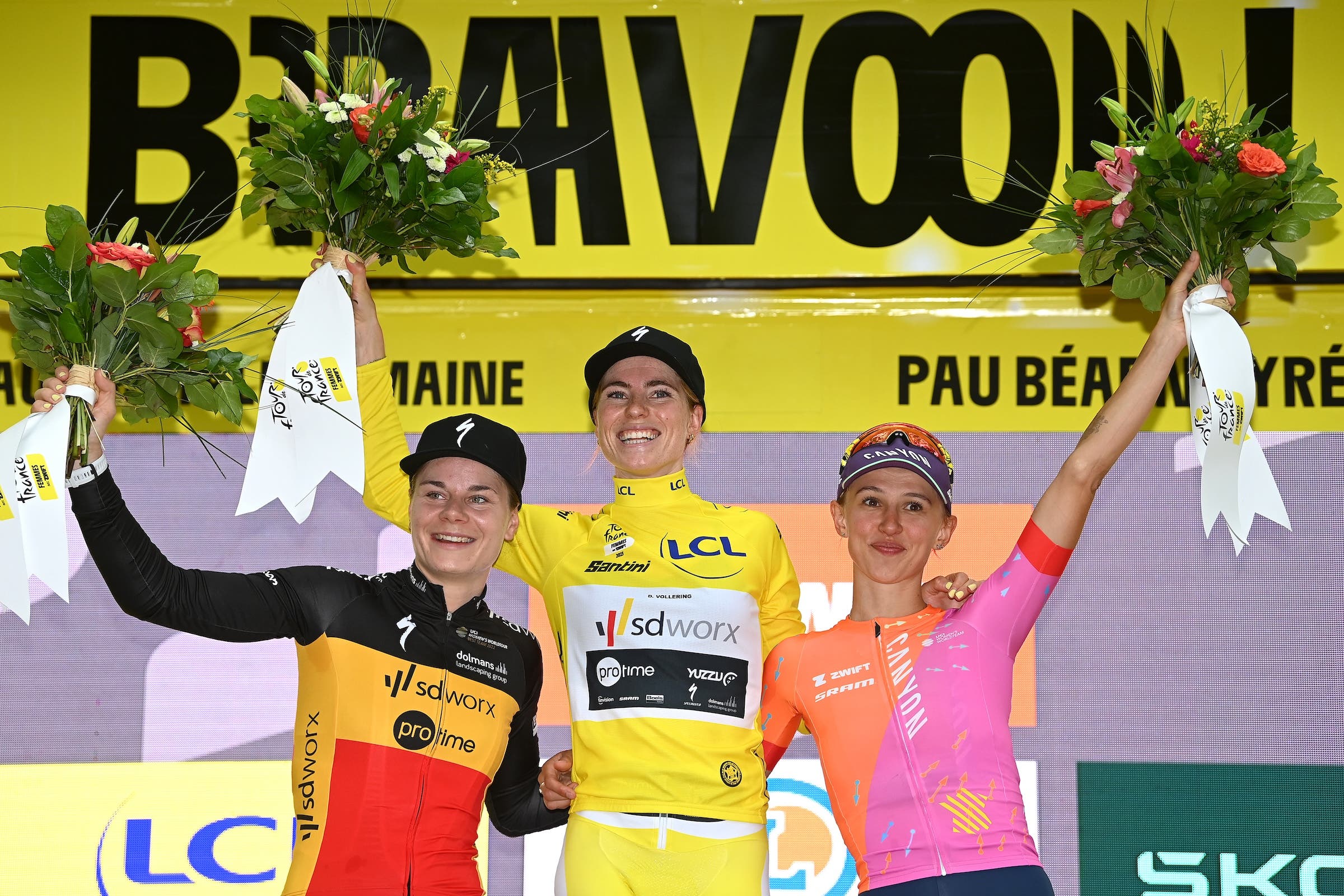 Lotte Kopecky of Belgium and Team SD Worx - Protime on second place, race winner Demi Vollering of The Netherlands and Team SD Worx - Protime - Yellow leader jersey and Katarzyna Niewiadoma of Poland and Team Canyon//SRAM Racing on third place pose on the podium ceremony after during the 2nd Tour de France Femmes 2023, Stage 8 a 22.6km individual time trial stage from Pau to Pau / #UCIWWT / on July 30, 2023 in Pau, France. (Photo by Tim de Waele/Getty Images)