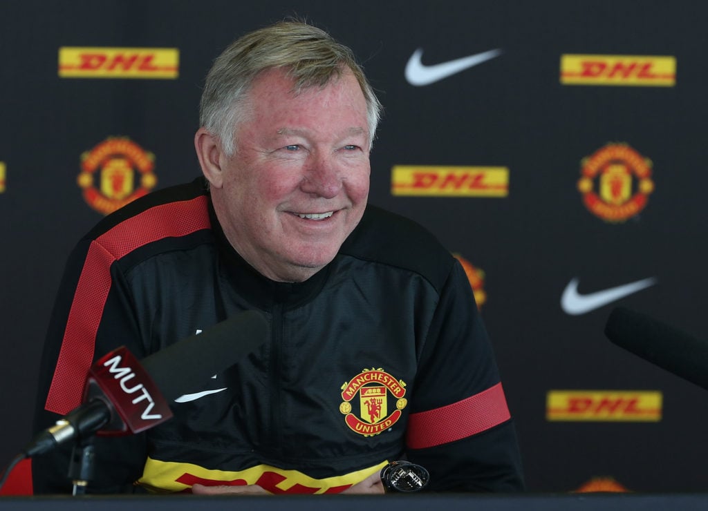 Former Manchester United manager Sir Alex Ferguson speaks during a press conference at the Carrington training complex in 2013 in Manchester, England.