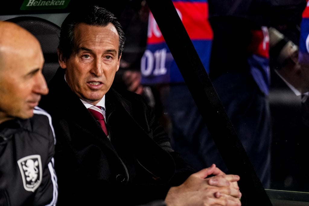 Aston Villa manager pictured on the bench during a Champions League game.