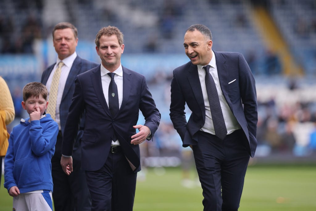 Leeds United owner Paraag Marathe speaks to colleague at Elland Road.