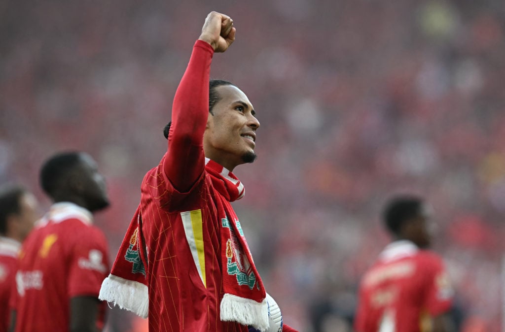 Virgil van Dijk pictured celebrating Liverpool's Premier League title win.
