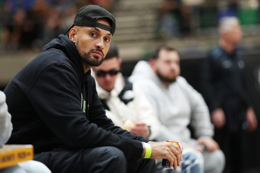 Nick Kyrgios watches the 2025 NBL Blitz match between South East Melbourne Phoenix and New Zealand Breakers at AIS Arena.