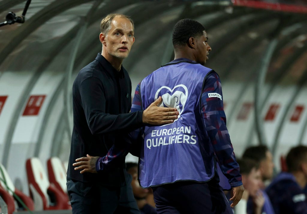 Thomas Tuchel interacts with Marcus Rashford during the 2026 FIFA World Cup qualifier match between Serbia and England at the Rajko Mitic Stadium in 2025 in Belgrade, Serbia.