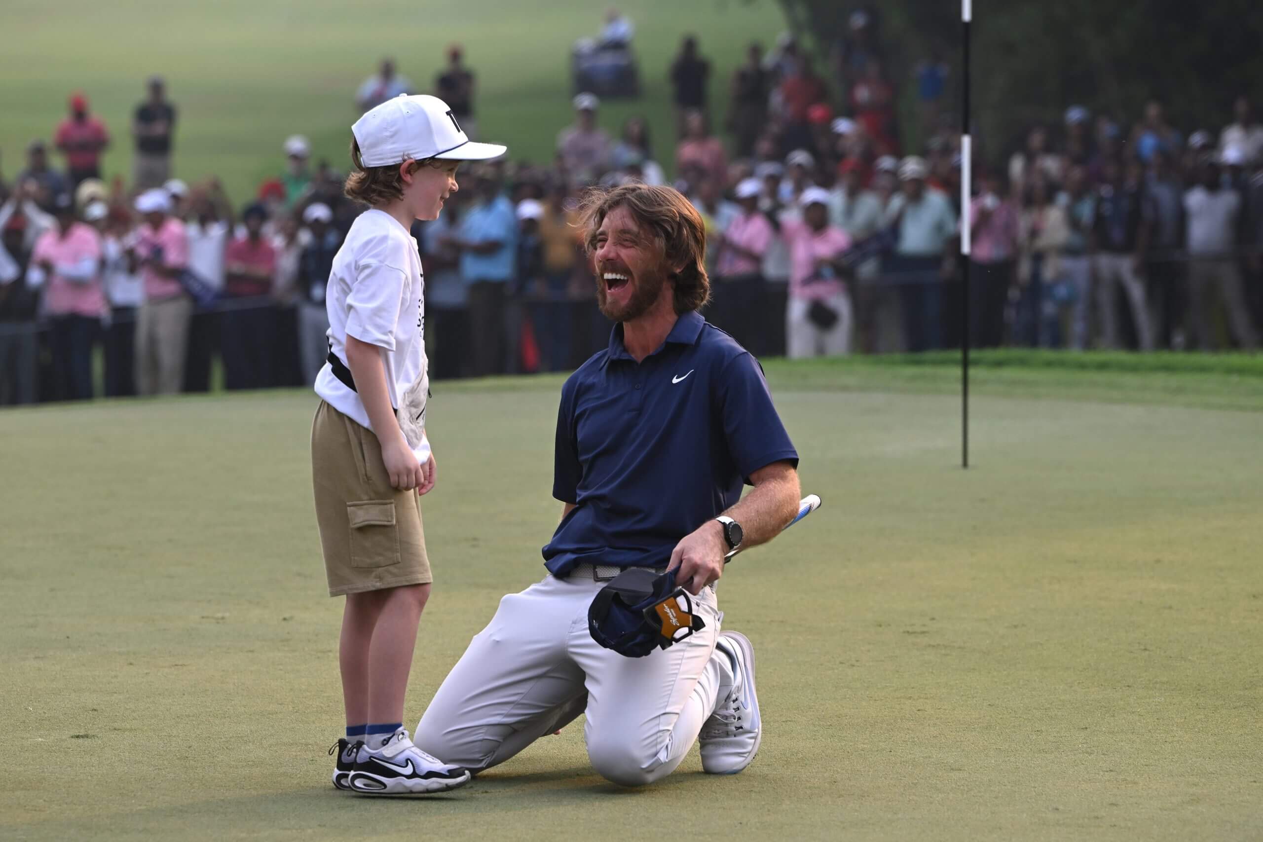 Frankie Fleetwood joins his father Tommy's celebration after winning the DP World Tour event in India.