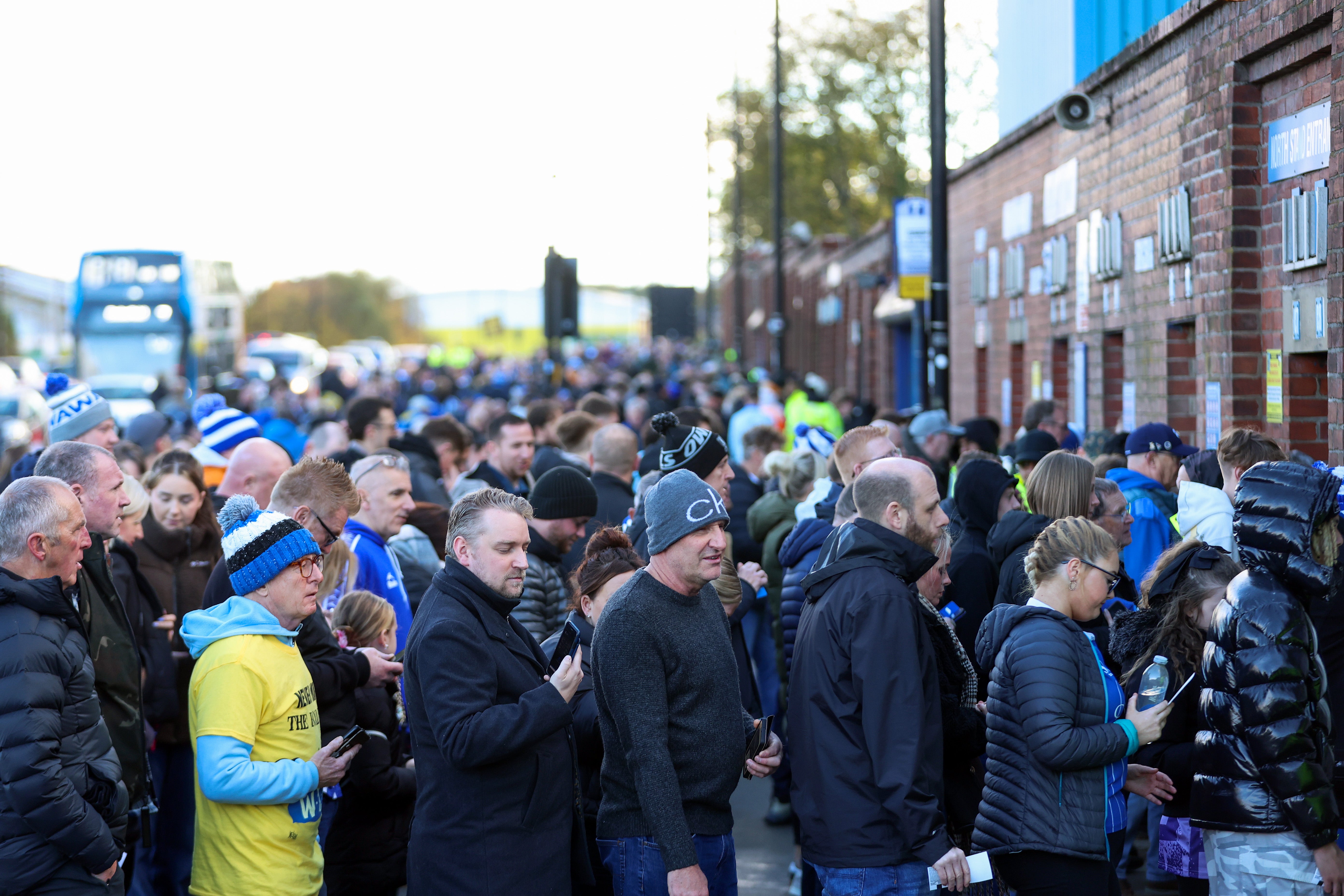 Fans queue outside the ground the day after the club entered administration