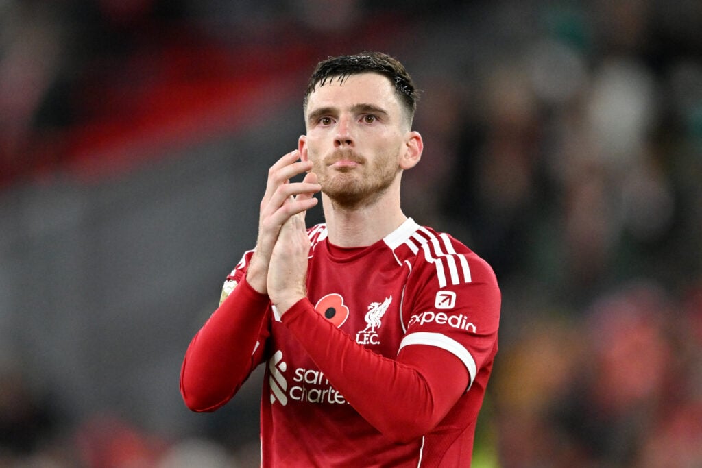 Andrew Robertson of Liverpool applauds the fans after the team's victory in the Premier League match between Liverpool and Aston Villa at Anfield.