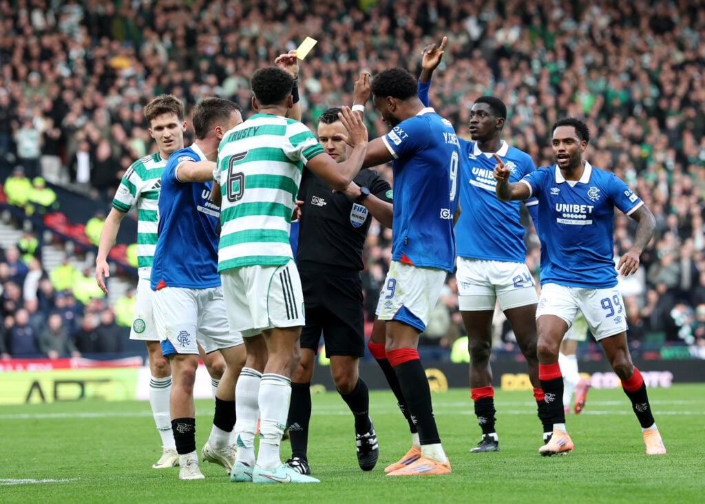 Auston Trusty disputes his yellow card during Celtic vs Rangers League Cup semi-final.