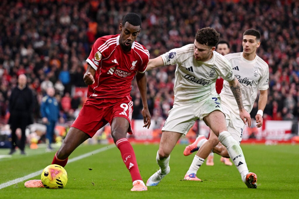 Alexander Isak of Liverpool is challenged by Neco Williams of Nottingham Forestduring the Premier League match between Liverpool and Nottingham Forest at Anfield