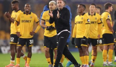 Rob Edwards claps fans with the Wolves players.