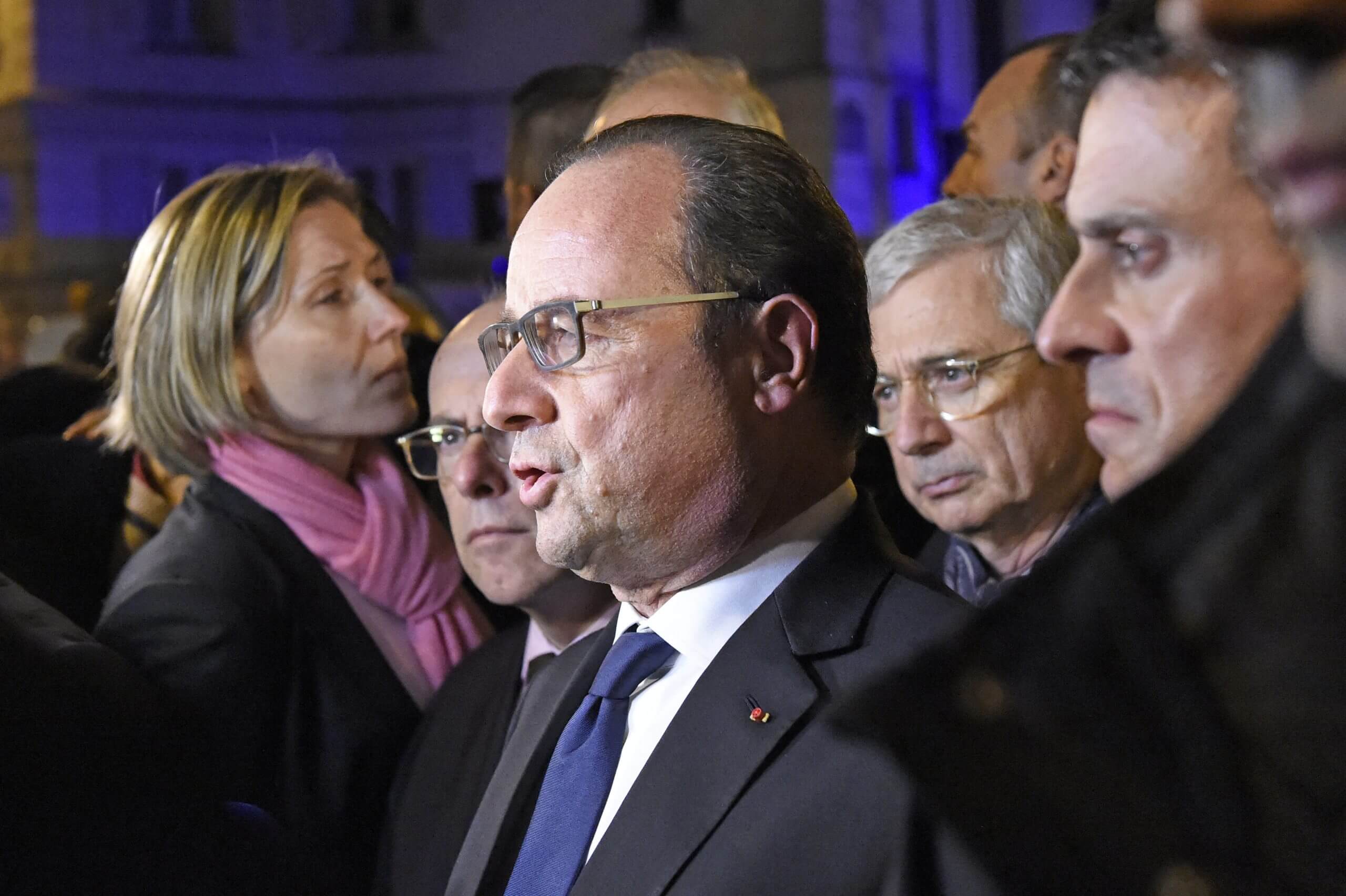 French President Francois Hollande addresses reporters near the Bataclan concert hall in the early hours of November 14