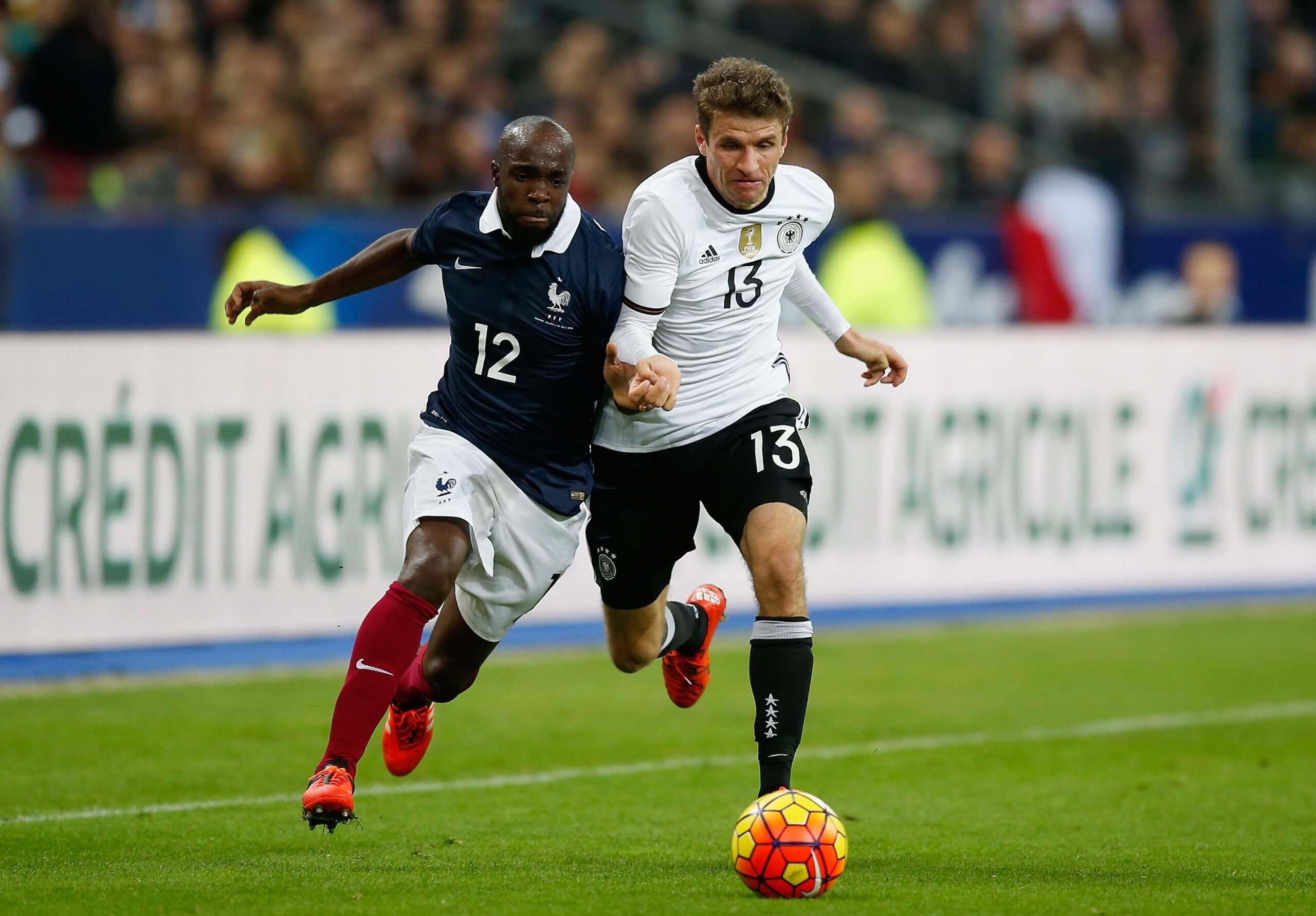 Lassana Diarra, who lost his cousin that night, takes on Germany's Thomas Mueller during the game