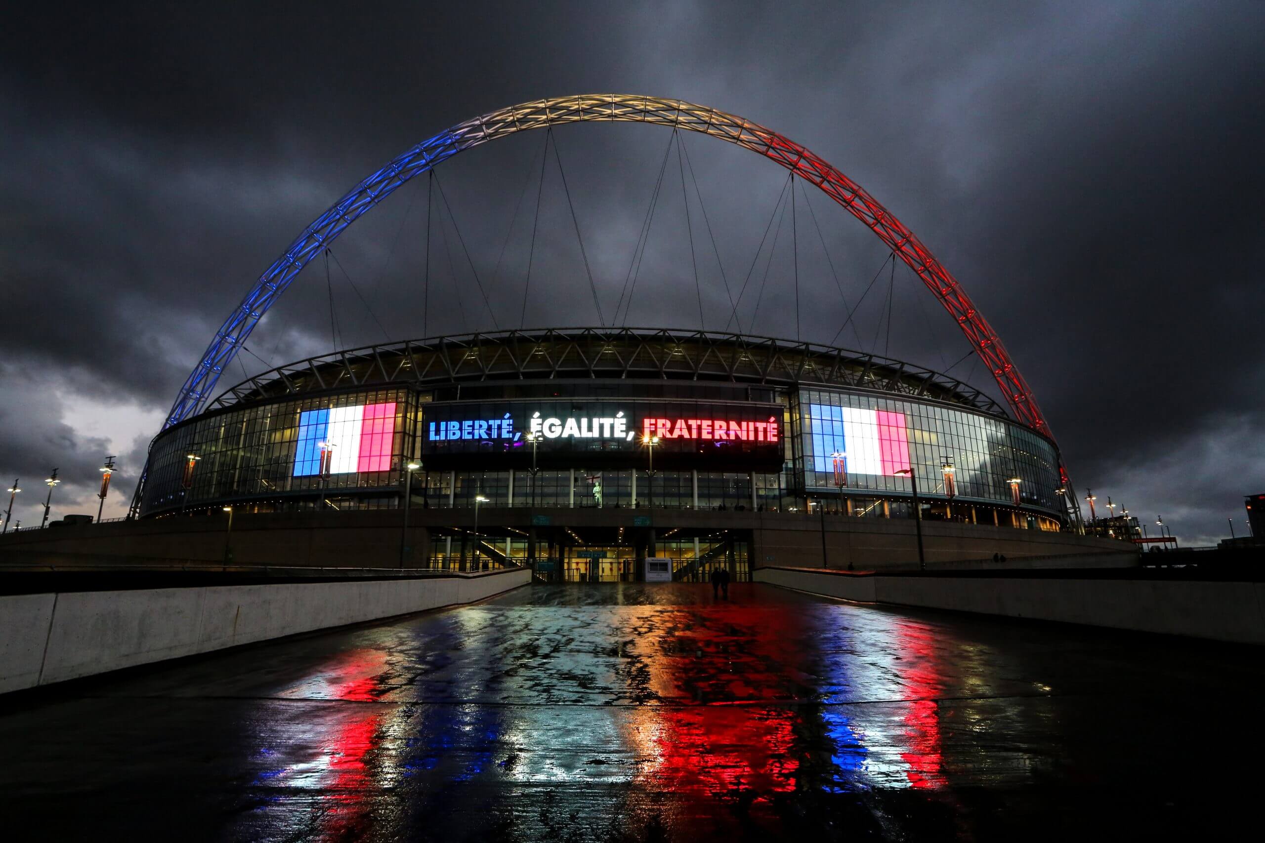 Wembley's arch is lit up with the colours of the French tricolour