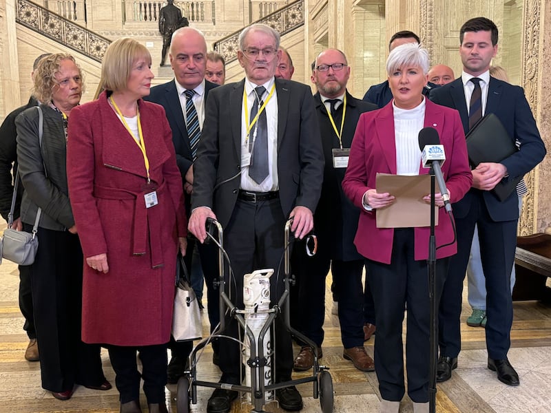 Survivor of the Kingsmill massacre Alan Black, pictured centre