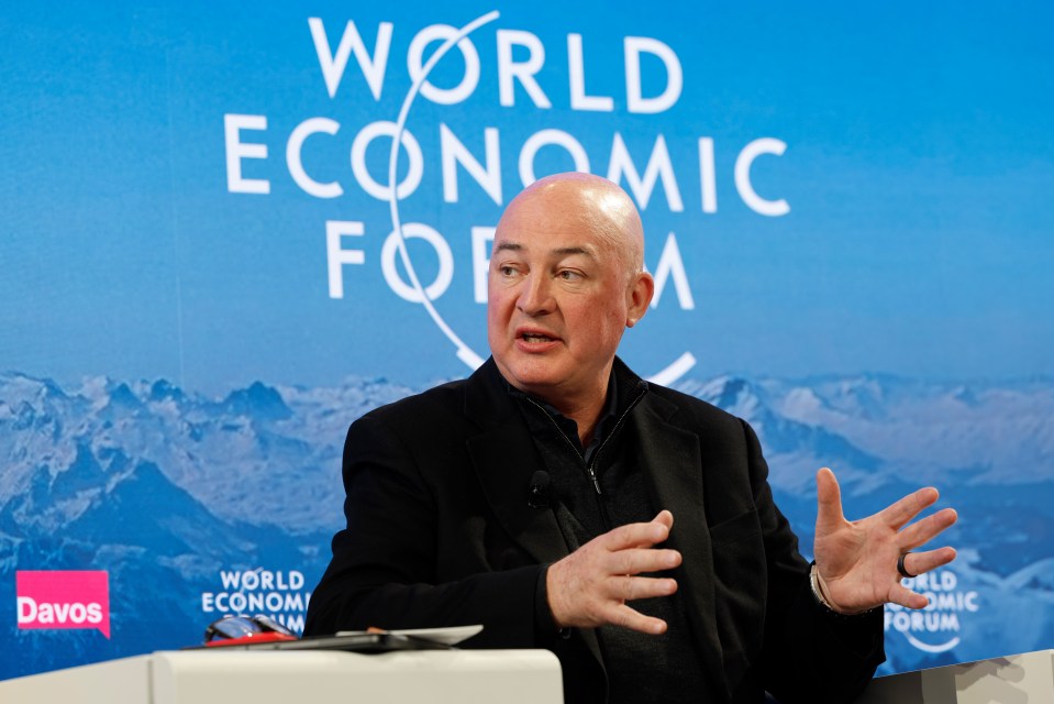 Jope in a professional setting discussing business strategies with colleagues, emphasizing collaboration and innovation