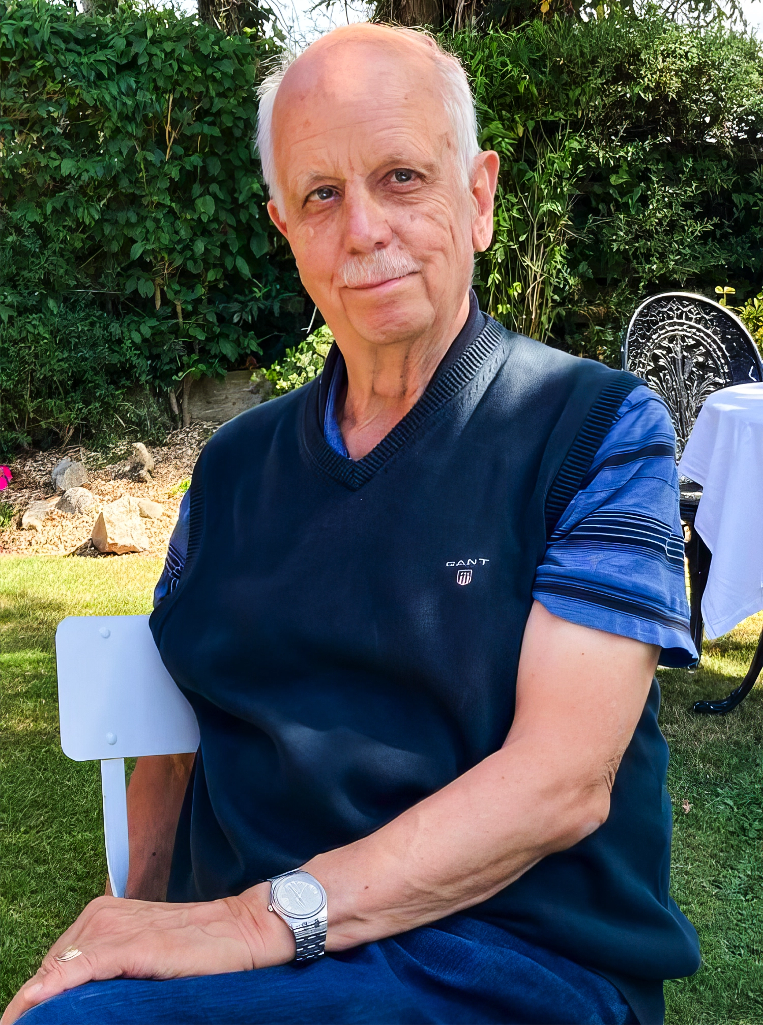 Portrait of a man with a white mustache.