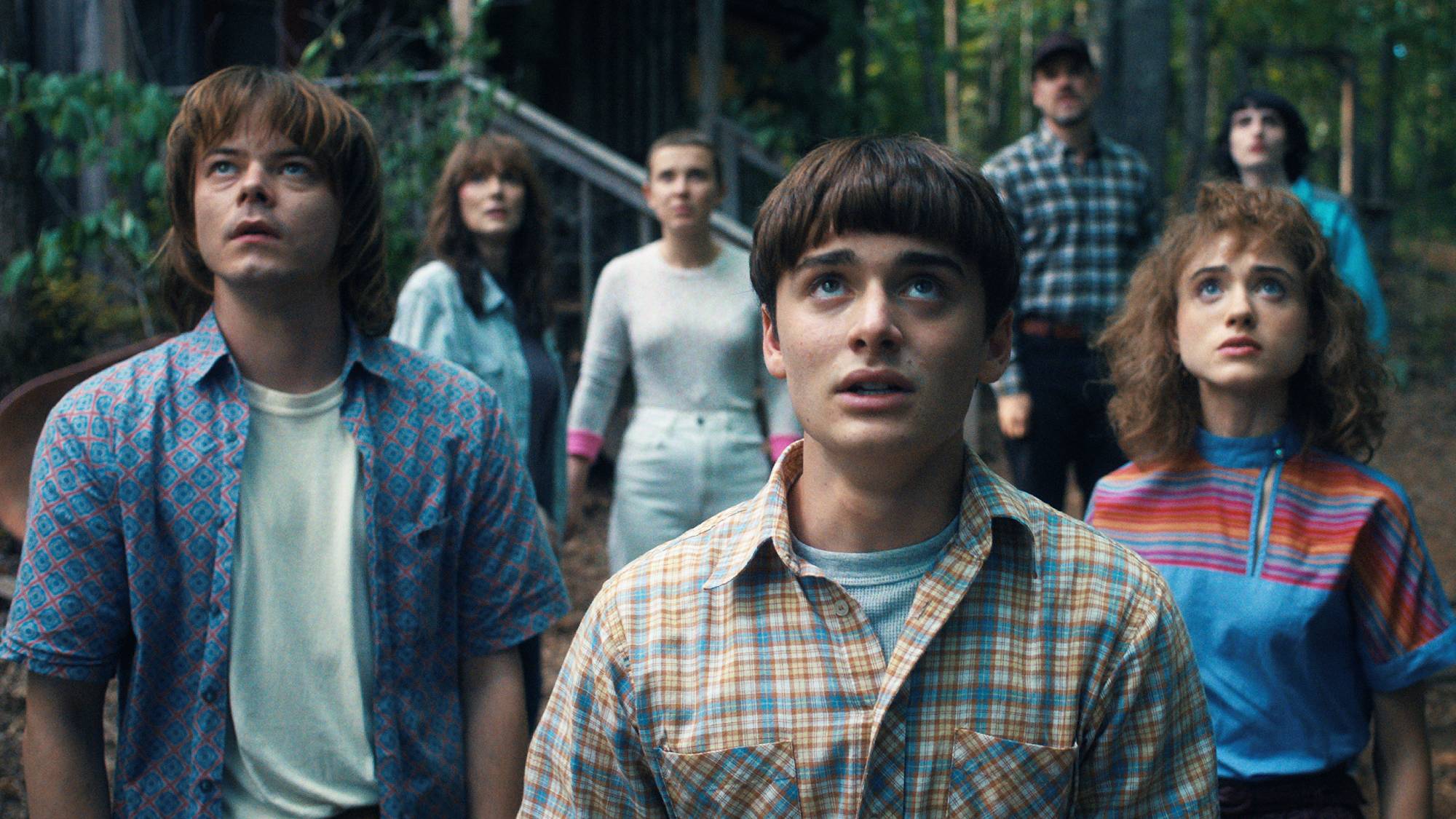 Charlie Heaton as Jonathan Byers, Winona Ryder as Joyce Byers, Millie Bobby Brown as Eleven, Noah Schnapp as Will Byers, David Harbour as Jim Hopper, Natalia Dyer as Nancy Wheeler, and Finn Wolfhard as Mike Wheeler in "Stranger Things" season 4