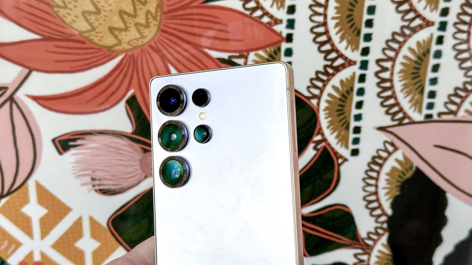 Galaxy S25 Ultra cameras in front of a patterned background
