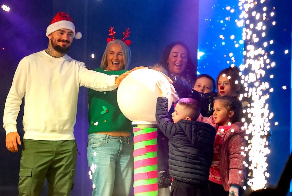 Lord Mayor Tracy Kelly with her family and special guest Lewis Crocker turning on the Christmas lights