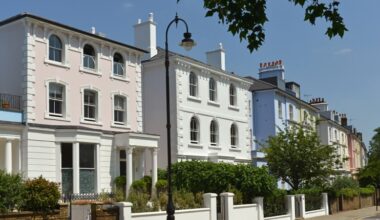 Luxurious mansion exterior featuring grand architecture, lush landscaping, and elegant design elements in a serene setting