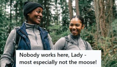 Woman holding disposable coffee cup