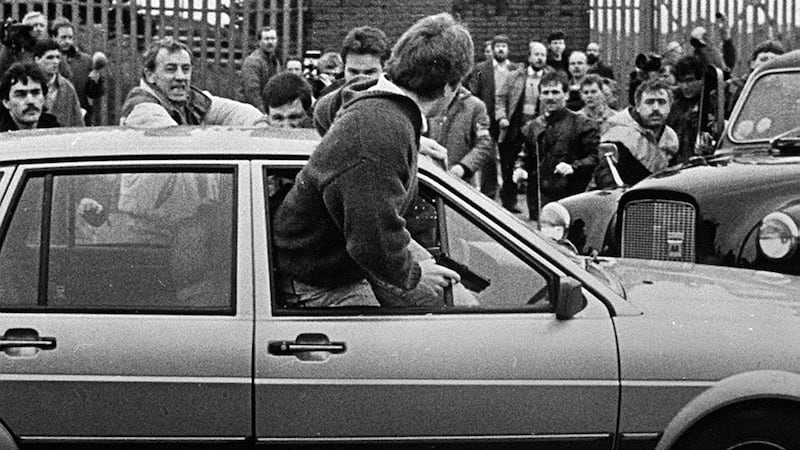British army corporal Derek Wood emerges from his car with a gun in his hand in Belfast in March 1988. Photograph: Pacemaker