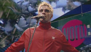 Watch Robbie Williams travel back in time to perform on 'The Word' for new 'Pretty Face' video