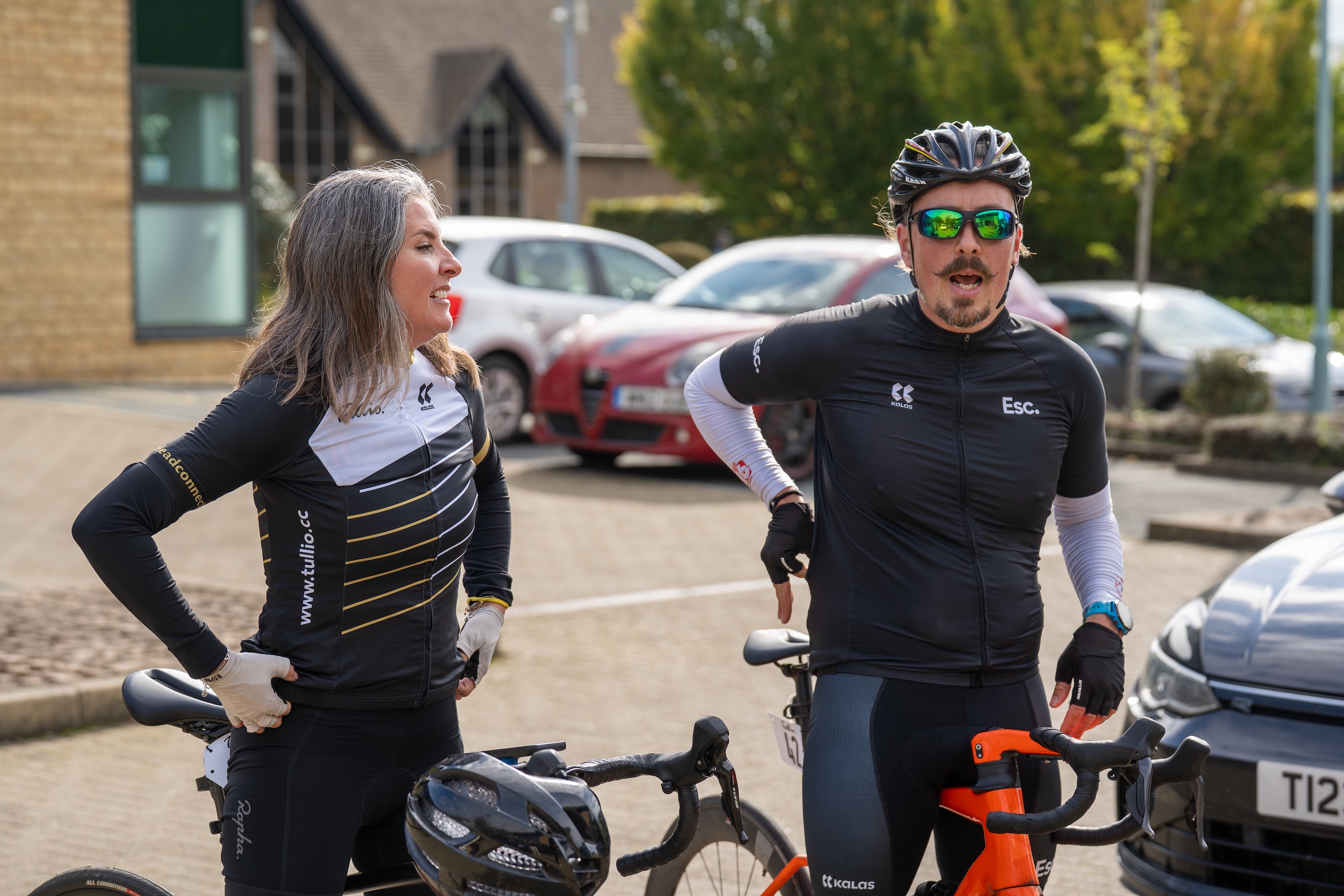 Stationary bike riders talking