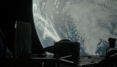 spacecraft photo of earth, with parts of the probe visible in the foreground