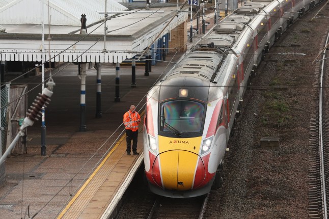 Drivers prepare to move the LNER Azuma train, on which a mass stabbing took place, away from the platform at Huntingdon Station in Huntingdon, eastern England, on November 3, 2025. UK police were working on Sunday to investigate a mass stabbing on a London-bound train that left left nine people in hospital with "life-threatening" wounds. The attack occurred on Saturday evening on the typically busy service between the town of Doncaster, in northern England, and King's Cross Station in the capital. The incident forced the train to stop at Huntingdon station, in Cambridgeshire. Police said the incident left 10 people in hospital, nine of whom were "believed to have suffered life-threatening injuries". (Photo by Chris RADBURN / AFP) (Photo by CHRIS RADBURN/AFP via Getty Images)