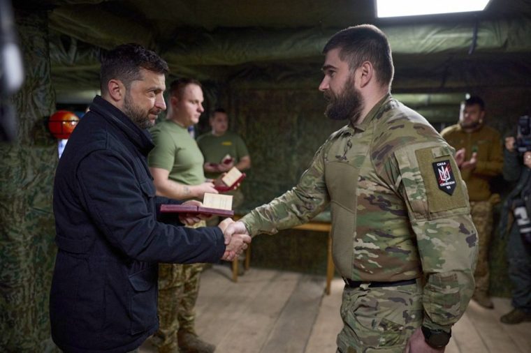 In this photo provided by the Ukrainian Presidential Press Office, Ukrainian President Volodymyr Zelenskyy, left, awards servicemen near the frontline city of Pokrovsk, Donetsk region, Ukraine, Tuesday, Nov. 4, 2025. (Ukrainian Presidential Press Office via AP)