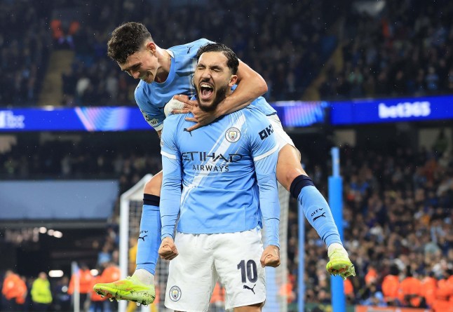 MANCHESTER, ENGLAND - NOVEMBER 5: Rayan Cherki of Manchester City celebrates with teammate with Phil Foden of Manchester City after scoring the fourth goal of his team during the UEFA Champions League 2025/26 League Phase MD4 match between Manchester City and Borussia Dortmund at City of Manchester Stadium on November 5, 2025 in Manchester, England. (Photo by Crystal Pix/MB Media/Getty Images)