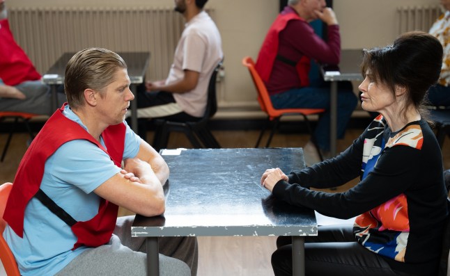Robert sits and talks to Faith in the prison visiting room in Emmerdale