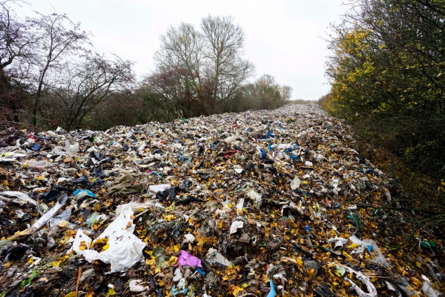 Shocking pictures show Britain's biggest ever fly tip - a pile of waste 500FT long dumped in one go. The massive heap of hazardous rubbish stretches 150m and is around 20ft (6m) deep. It was illegally dumped in a field next to the A34 and River Cherwell near Kidlington in Oxfordshire. The waste was left in one go and described by an MP as "threatening an environmental disaster". Kidlington, Oxfordshire. November 14 2025. // Shocking pictures show Britain's biggest ever fly tip - a pile of waste 500FT long dumped in one go. The massive heap of hazardous rubbish stretches 150m and is around 20ft (6m) deep. It was illegally dumped in a field next to the A34 and River Cherwell near Kidlington in Oxfordshire. The waste was left in one go and described by an MP as "threatening an environmental disaster". Photo released 14/11/2025