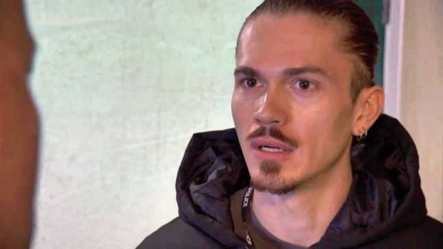 Sully looks shocked in Hollyoaks