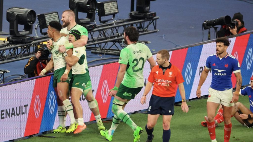 Sacha Feinberg-Mngomezulu celebrates his first try with his South African team-mates