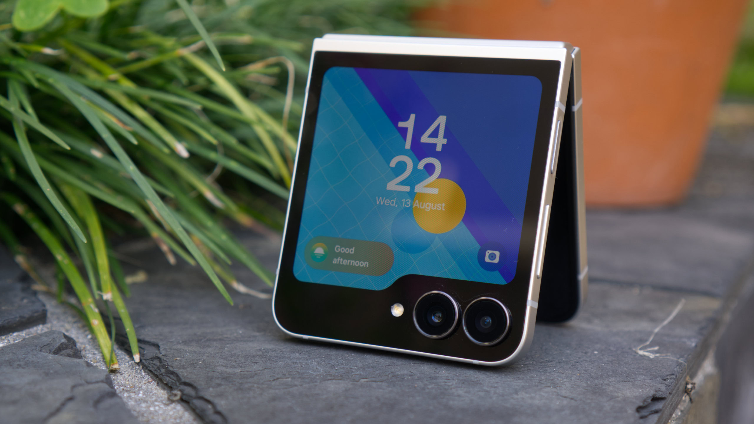 Samsung Galaxy Z Flip 7 FE tented showing cover screen Samsung Galaxy Z Flip 7 FE tented showing cover screen