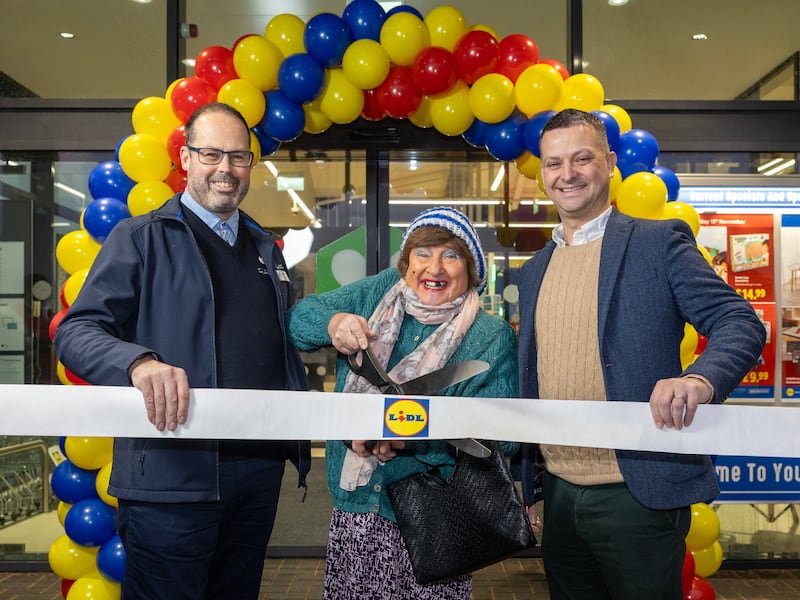 L-R: Matthew Weavers, manager of Lidl's Ballysillan Road store; May McFettridge; and Gordon Cruikshanks, Lidl's regional managing director.