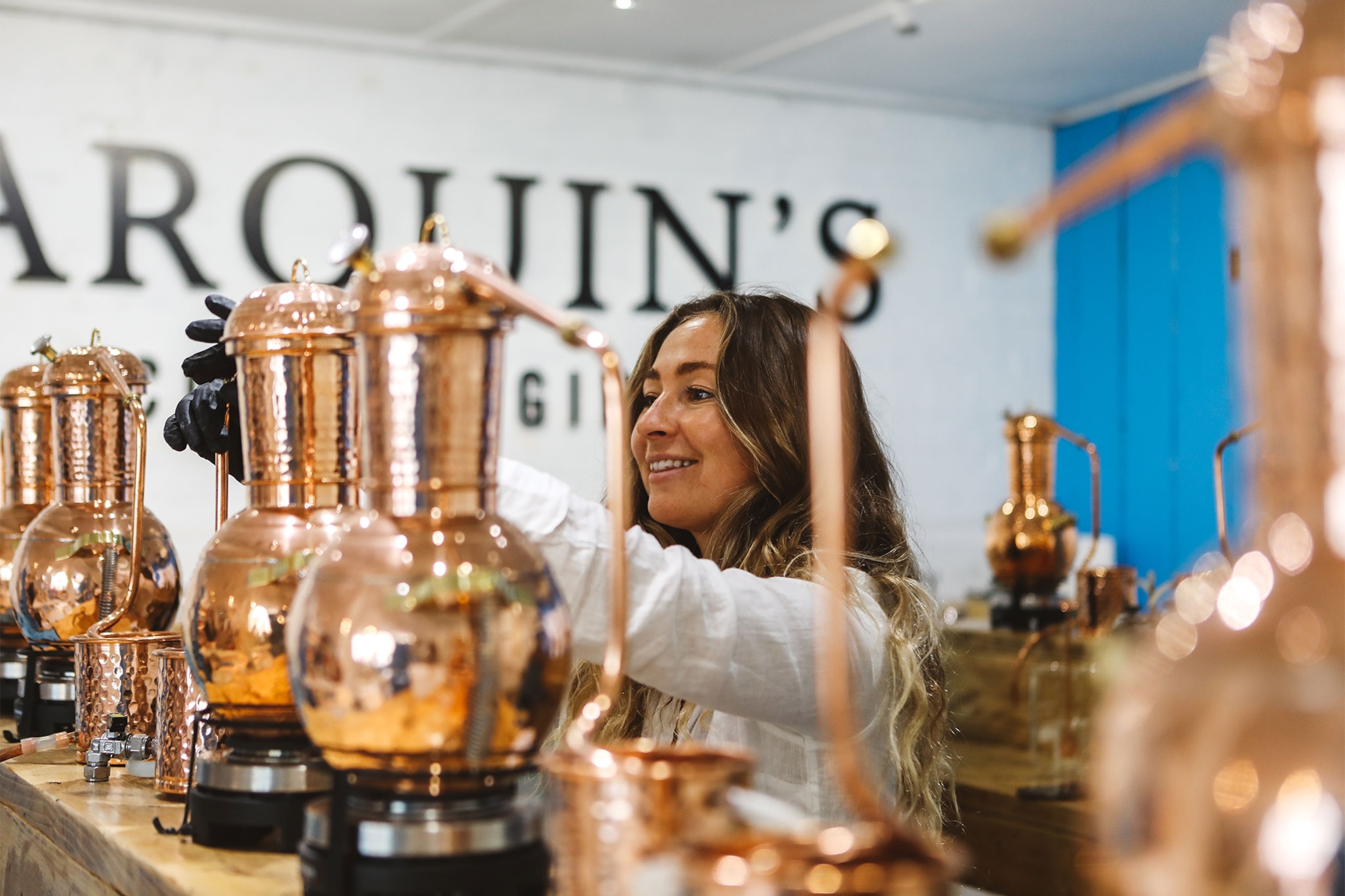 Tarquins Gin School gin workshop participant with copped pots