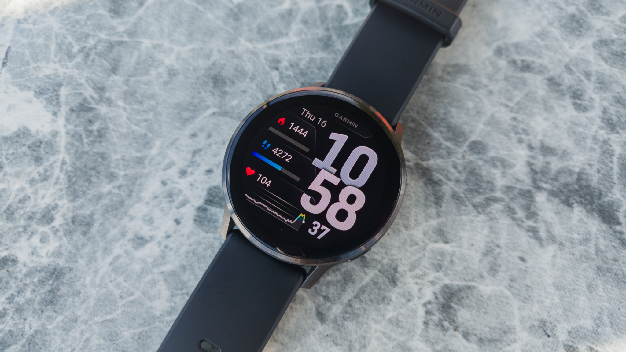 The Garmin Venu 4 on a marble surface