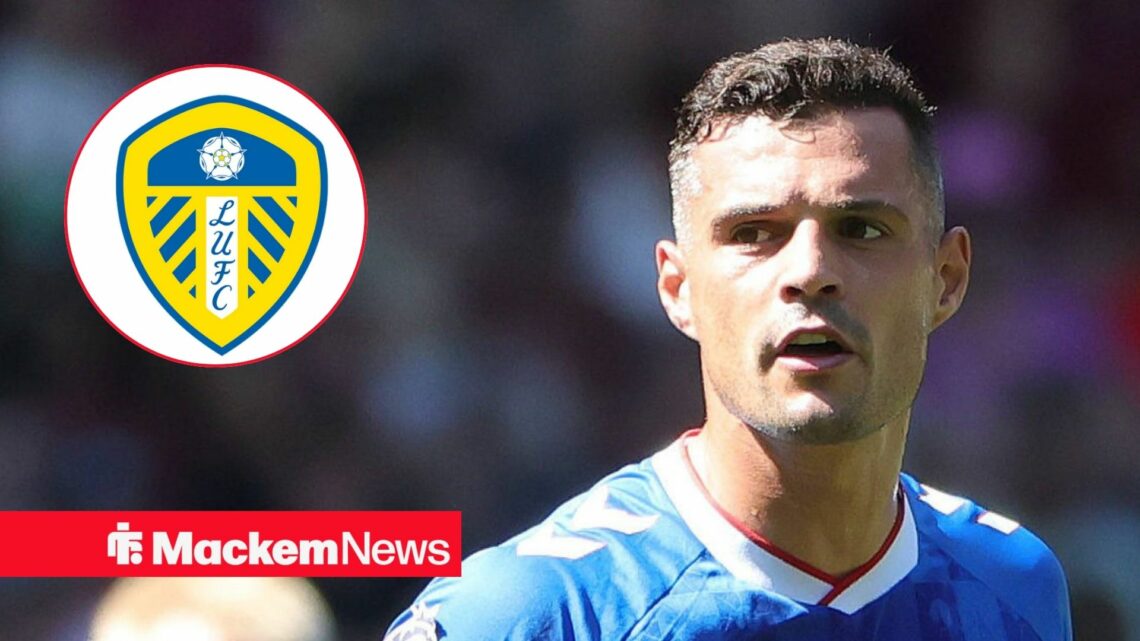 Granit Xhaka in action for Sunderland looking at Leeds United badge in circular inset
