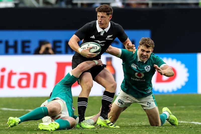 Ireland's Garry Ringrose tackles New Zealand's Cameron Roigard. Photograph: Gary Carr/Inpho