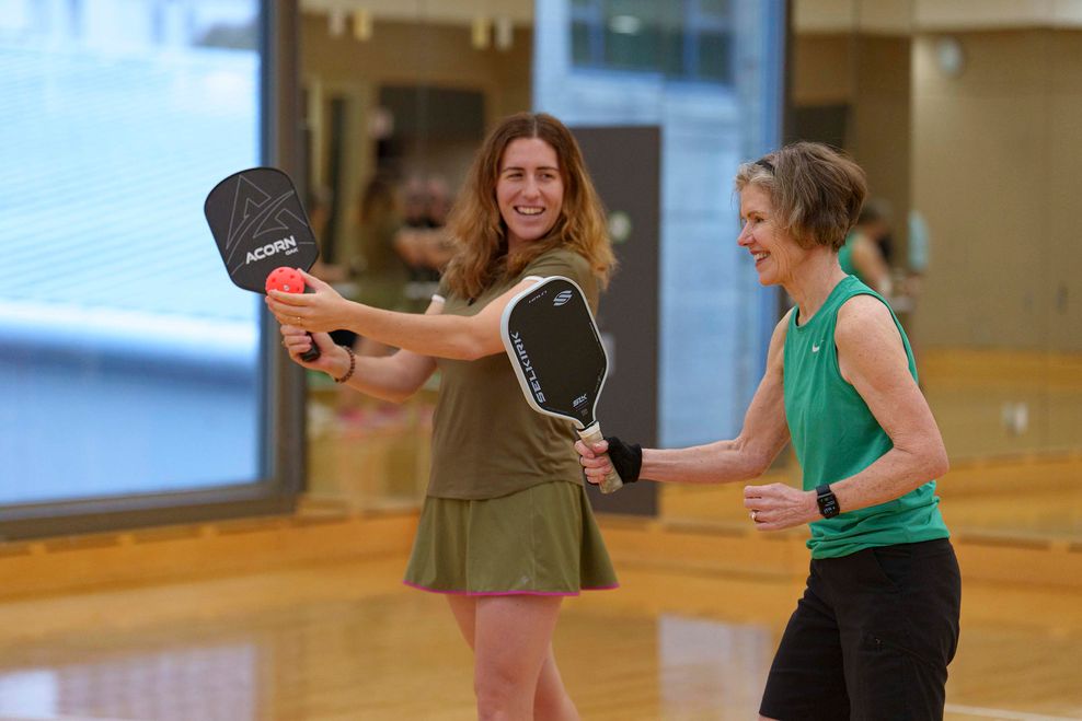 Two women play Pickleball